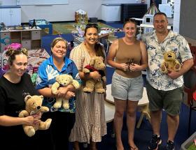 College staff holding teddy bears at the Palmerston ELC